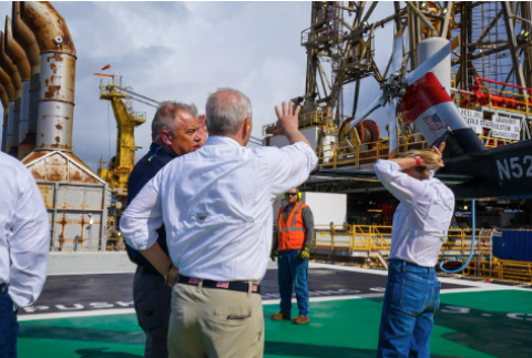 Leader Scalise speaks with Occidental personnel after landing on the platform.