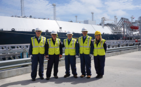 The group gathers in front of an LNG vessel soon departing across the globe to deliver enough energy to power 45,000 homes in Poland for a year.